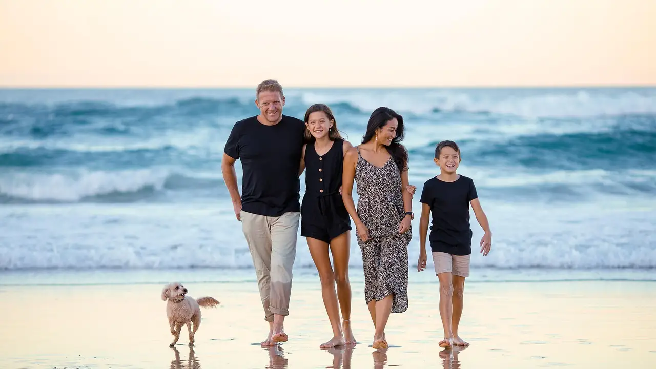 Family walking together along the beach