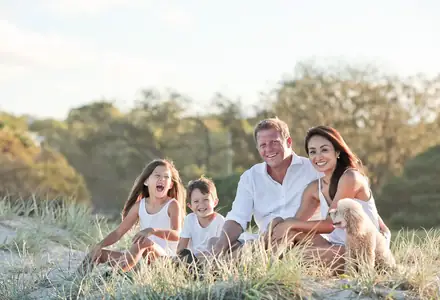 Family with children sitting together outdoors