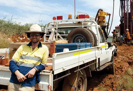 FIFO worker in high visibility workwear on a drill site